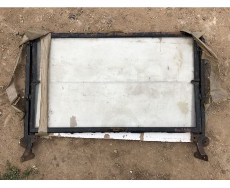 A Motor Products Corporation windscreen with side brackets, possibly Ford Model T.