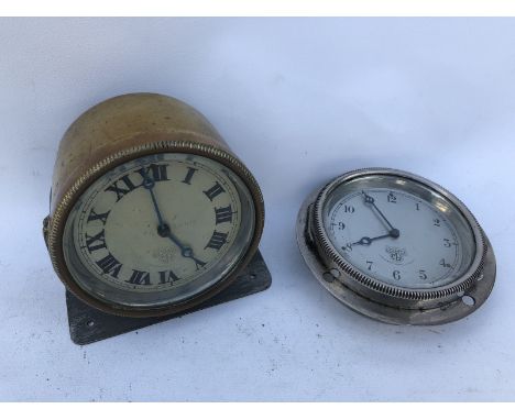 A Smiths eight day car clock, brass bodied and display base mounted and one other. 