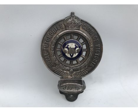 A Royal Automobile Club of Victoria, Australia car badge, circa 1920s, enamelled to one side with the badge of the RACV and t