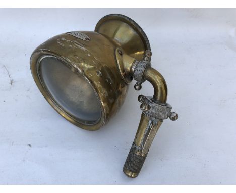 A Realite brass pass lamp with fittings attached. 