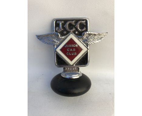 A Junior Car Club part enamel car badge stamped J3014, by Elkington & Co., radiator cap mounted.