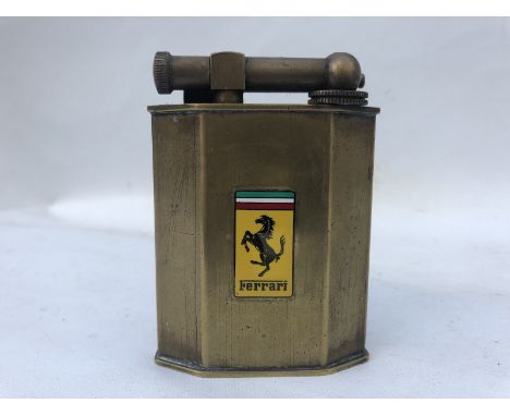 A good quality brass lighter by Polaire of Paris, with an enamel Ferrari plaque to the front.