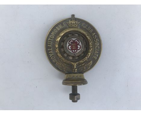 An RAC Associate car badge with The Lancashire Automobile Club part enamel centre, brass 1912 pattern, no. J539.