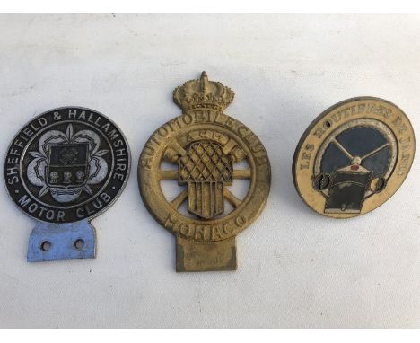 A Sheffield and Hallamshire Motor Club car badge, an Automobile Club of Monaco and one other. 