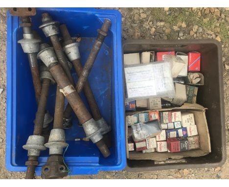 A box of new old stock lamp bulbs, a chain hoist and a quantity of Riley engine bearer bars.