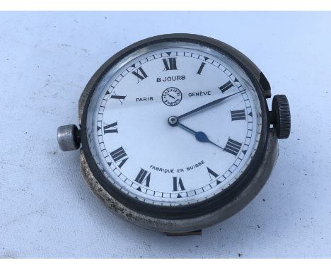 A Jaeger eight day car clock, side wind. 