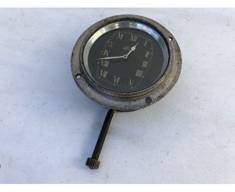 A Jaeger black faced eight day car clock, bottom wind.