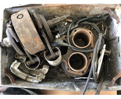 A box of BSA Twin engine parts. 