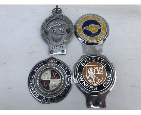Four assorted car badges to include Commercial Motor Users Association and Royal East African Automobile Association.