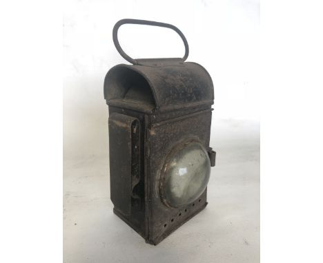A lamp with swing handle to the top, possibly traction engine or railway.