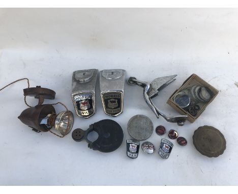 A small selection of parts etc. to include Morris badges, motometer parts etc., also a rare leather cased inspection lamp.