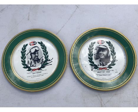 A Bruce Maclaren signed Champion promotional plate and another for Mike Spence.
