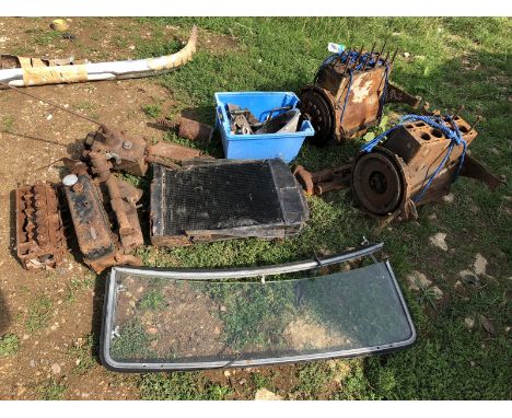 A collection of Morris 10hp engine parts, a windscreen etc.