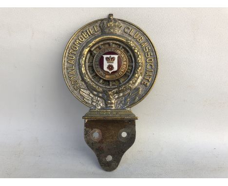 A Royal Automobile Club Associate car badge with Hampshire Automobile Club enamel centre, stamped N265, with original backing