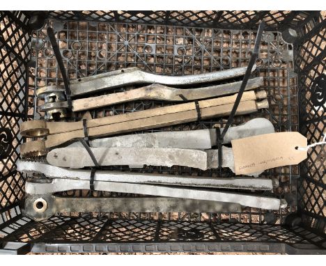 A quantity of windscreen brackets. 