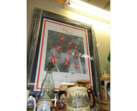 A framed and glazed print of the Red Arrows signed by the pilots. COLLECT ONLY.