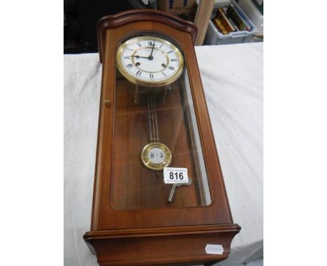 A modern wall clock in working order.