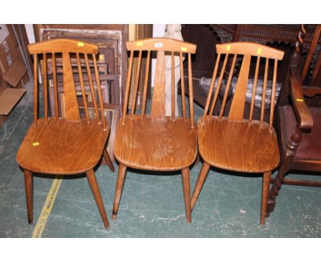 A set of 3 laminated stained beechwood dining chairs of ercol design 