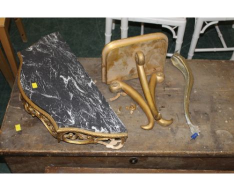 A gilt wood rectangular wall bracket with scrolled supports, 26 cm wide x 29 cm high and a damaged gilt console table 