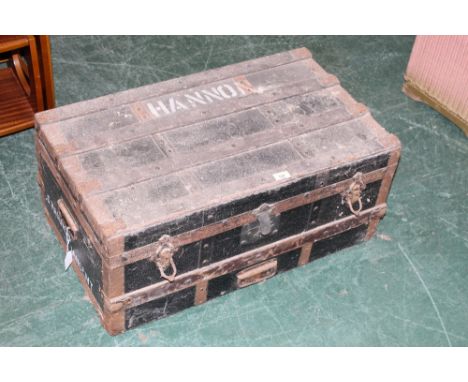 An early 20th century ebonised and metal bound trunk the lid and sides worded  S.Hannon 72 cm wide