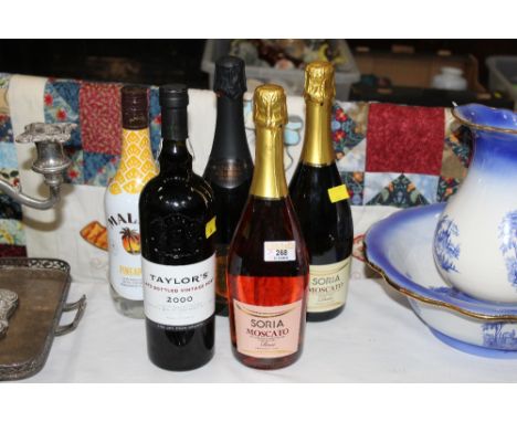 Bottle of vintage port, bottle of Malibu, three bottles of sparkling wine