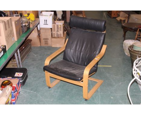 A laminated light oak and black leather  armchair 