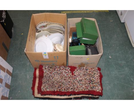 Two boxes of decorative plates, rug, projector etc  