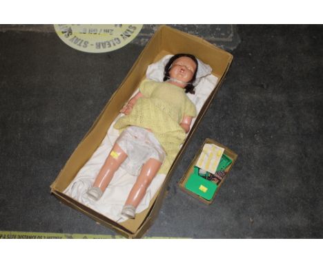 Vintage doll and small box of dolls house furniture