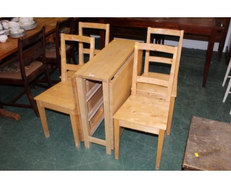 A modern light wood dining set comprising drop leaf table and a set of four chairs 