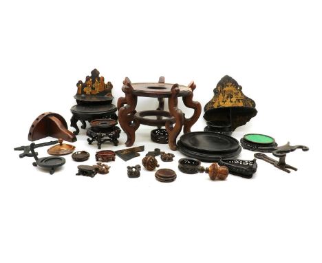 A group of hardwood oriental stands and lacquered brackets, 20th century, the stands of various shapes and forms, larger jard