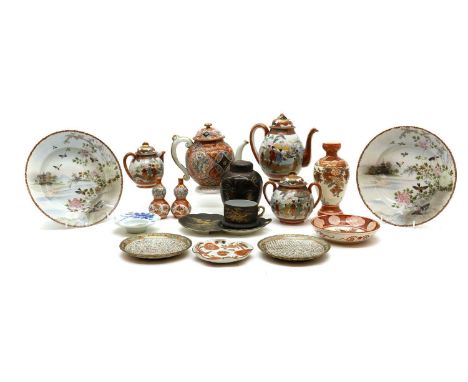 A collection of Japanese Kutani ware,19th to 20th century, comprising: a tea set, an additional teapot, a pair of double gour