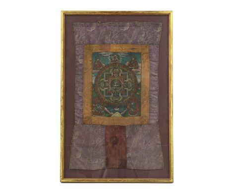 A Tibetan Thanka,20th century, depicting a seated bodhisattva within roundels surrounded by other dieties,63 x 40cm, framed a