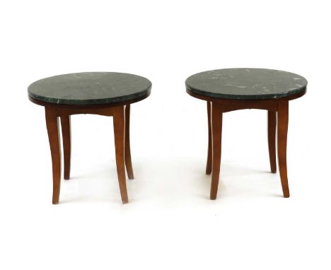 A pair of teak and marble side tables,late 20th century, the circular tops raised on splayed supports,51cm diameter46cm high 