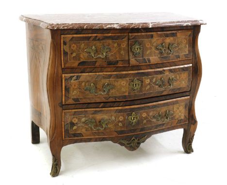 A French Louis XV style inlaid walnut commode,19th century, with a marble top over the serpentine front, with three drawers, 