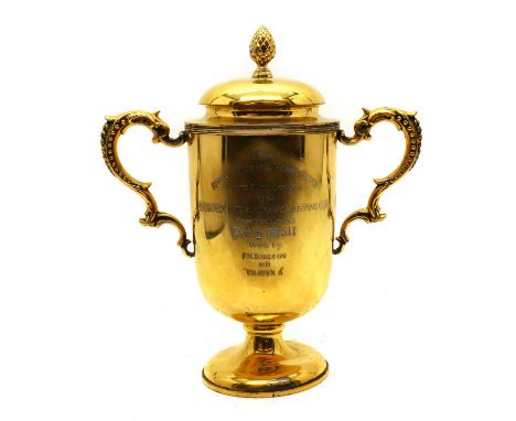 A silver gilt International Horse Show trophy,by William Hutton &amp; Sons Ltd, Sheffield 1911, with scrolled handles, engrav