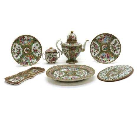 A collection of Chinese Canton famille rose,19th century, comprising: a teapot, a sugar bowl, a stand, a spoon tray, and thre