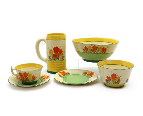 A collection of Clarice Cliff ‘Sungleam Crocus’ items, comprising; an Athens shape cup with a saucer and side plate, a large 