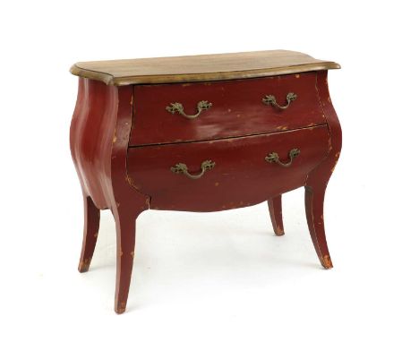 A Louis XV style bombe commode, the plain top with a serpentine moulded edge, over a red painted body, comprising two drawers