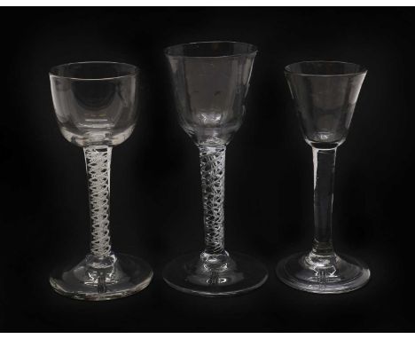 An 18th century wine glass,c.1750, with a moulded ogee bowl, over a double series air twist stem, with a central air cable an