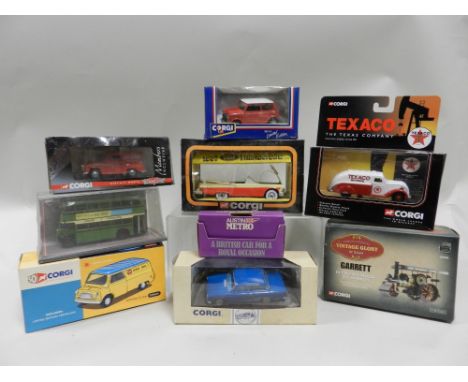 A group of boxed Corgi die cast toys of varying packaging styles and ages to include buses, trucks, vans and cars