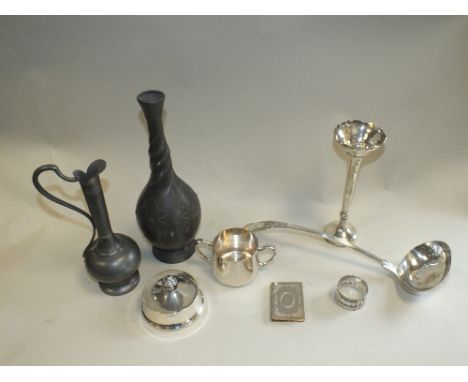 A group of silver and plate including a bud vase, ladle, stamp box, napkin ring etc. together with a pewter vase and a pewter