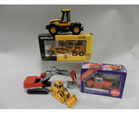Fourteen boxed and unboxed models of earth moving equipment by manufacturers such as Ertl, Joal and others in various scales