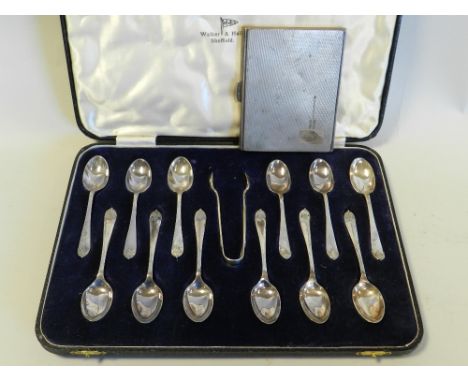 A silver and gilt cigarette case with engine turned decoration, hallmarked Sheffield, Walker and Hall, weight 5.5oz, together
