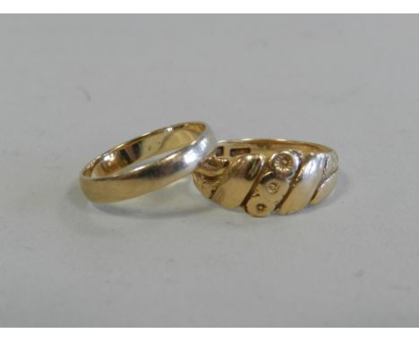 An 18ct gold ring, weight 4.5gms, together with a 9ct plain gold band, weight 1.5gms