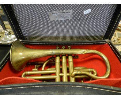 A cased brass cornet of WW1 interest by Kohler and Sons inscribed M J D Cockle, Charter House band 1883-1885 lent to the band