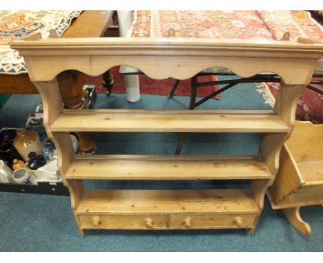 A pine kitchen wall shelf with shaped canopy and two open shelves above two short drawers, 94cm wide, 17cm deep, 93cm high
