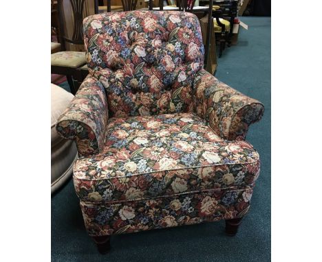 A modern Enigma upholstered button back armchair in Victorian style, upholstered in bright floral covers 