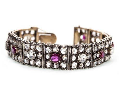 RUBY AND DIAMOND BRACELET, each panel set with rose cut diamonds with alternating ruby and rose cut diamond centre stones, th