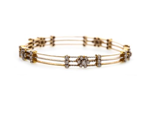 DIAMOND BANGLE, of circular form, with diamond clusters interspaced by diamond set bars, 7.3mm wide, 65mm to outer edge, unma