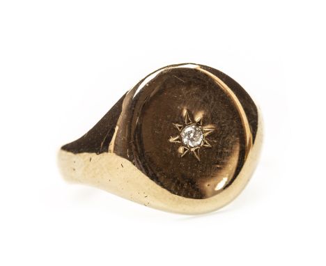 GENTLEMAN'S DIAMOND SET SIGNET RING, the oval bezel with a central star set diamond of approximately 0.04 carats, in nine car